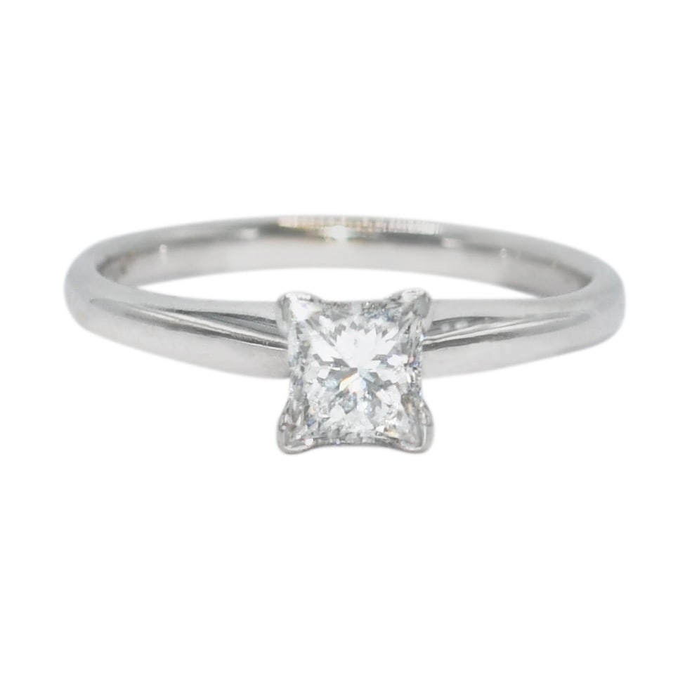 GSL Certified 18K White Gold Princess Cut Diamond Solitaire Ring: GSL Certified 18K White Gold Princess Cut Diamond Solitaire Ring This elegant engagement ring features a 0.71 carat natural princess cut diamond set in 18K white gold. The diamond has a D color, I1 cl