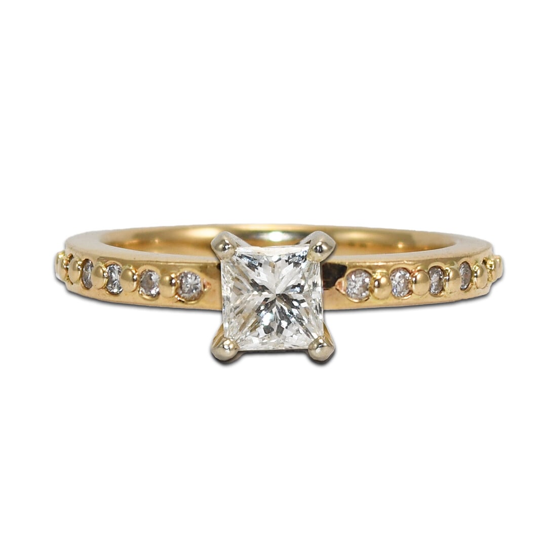 14k Yellow Gold Princess Cut Diamond Solitaire Ring 0.65ct: 14k Yellow Gold Princess Cut Diamond Solitaire Ring 0.65ct This 14k yellow gold engagement ring features a 0.65 carat princess cut diamond as the centerpiece, graded G-H-I in color and SI1-SI2 in clar