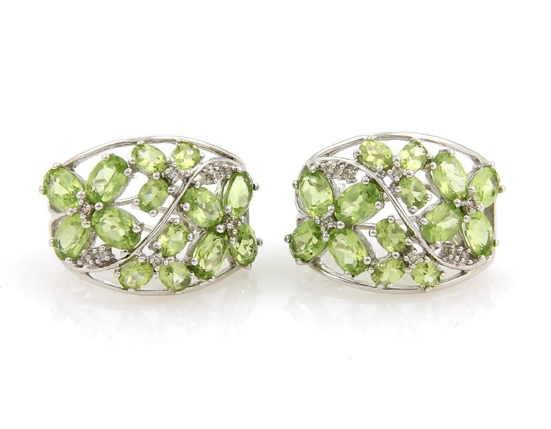 Vintage 14k White Gold Huggie Earrings with Peridot and Diamond Accents: Vintage 14k White Gold Huggie Earrings with Peridot and Diamond Accents Vintage semi-hoop huggie earrings crafted in 14k white gold, featuring natural peridots accented by natural diamonds. This origi