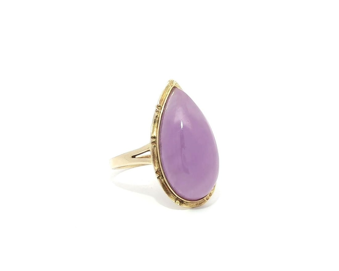 14k Yellow Gold Bamboo Halo Ring with Lavender Jade Cabochon: 14k Yellow Gold Bamboo Halo Ring with Lavender Jade Cabochon This exquisite ring features a stunning natural lavender jade stone, elegantly cut into a pear cabochon shape. The jade measures approximat