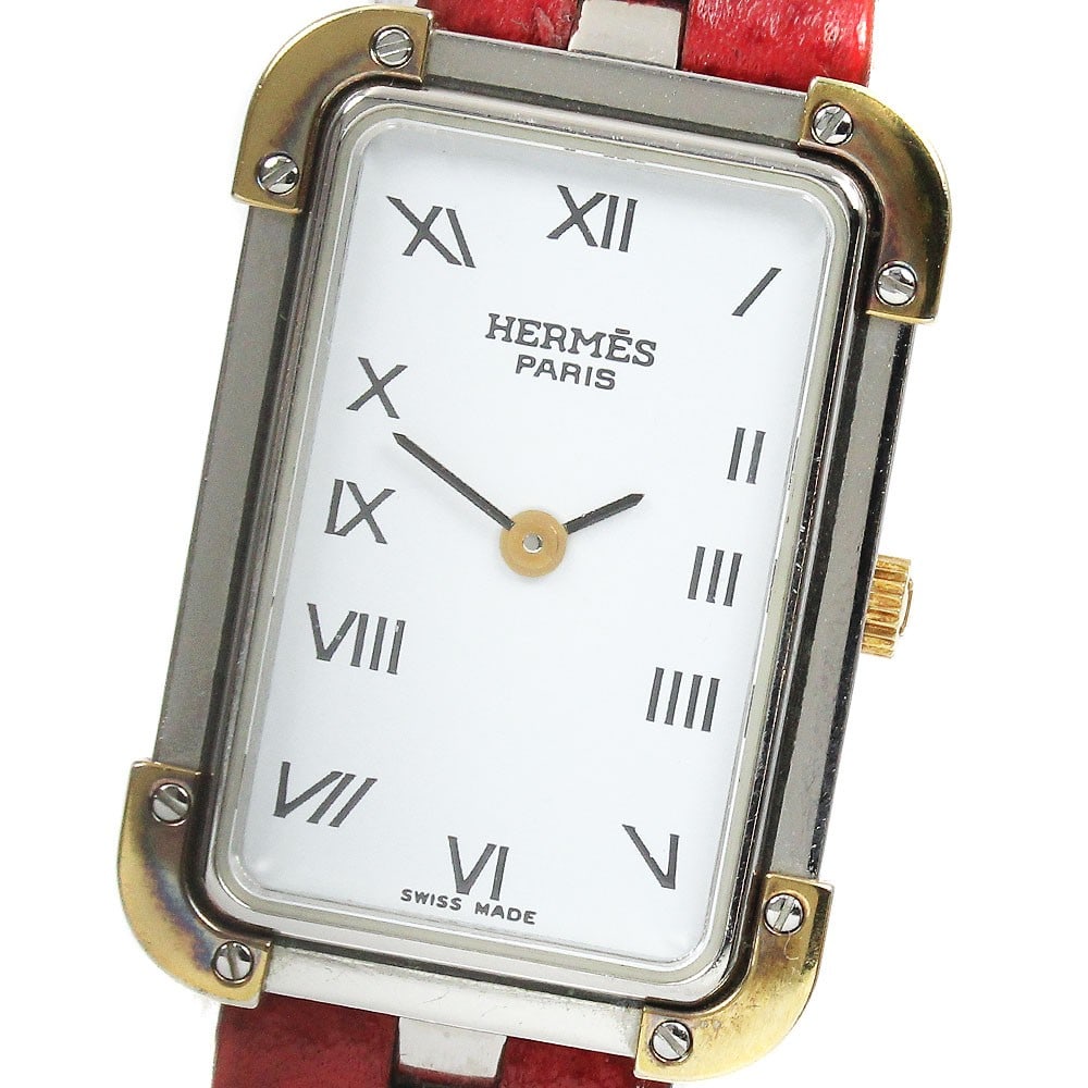 Hermes Clois Jour quartz ladies wristwatch white dial leather strap: Hermes Clois Jour quartz ladies wristwatch white dial leather strap This Hermes Clois-Jour women's wristwatch features a stainless steel and gold-plated case paired with a white dial and a leather bra