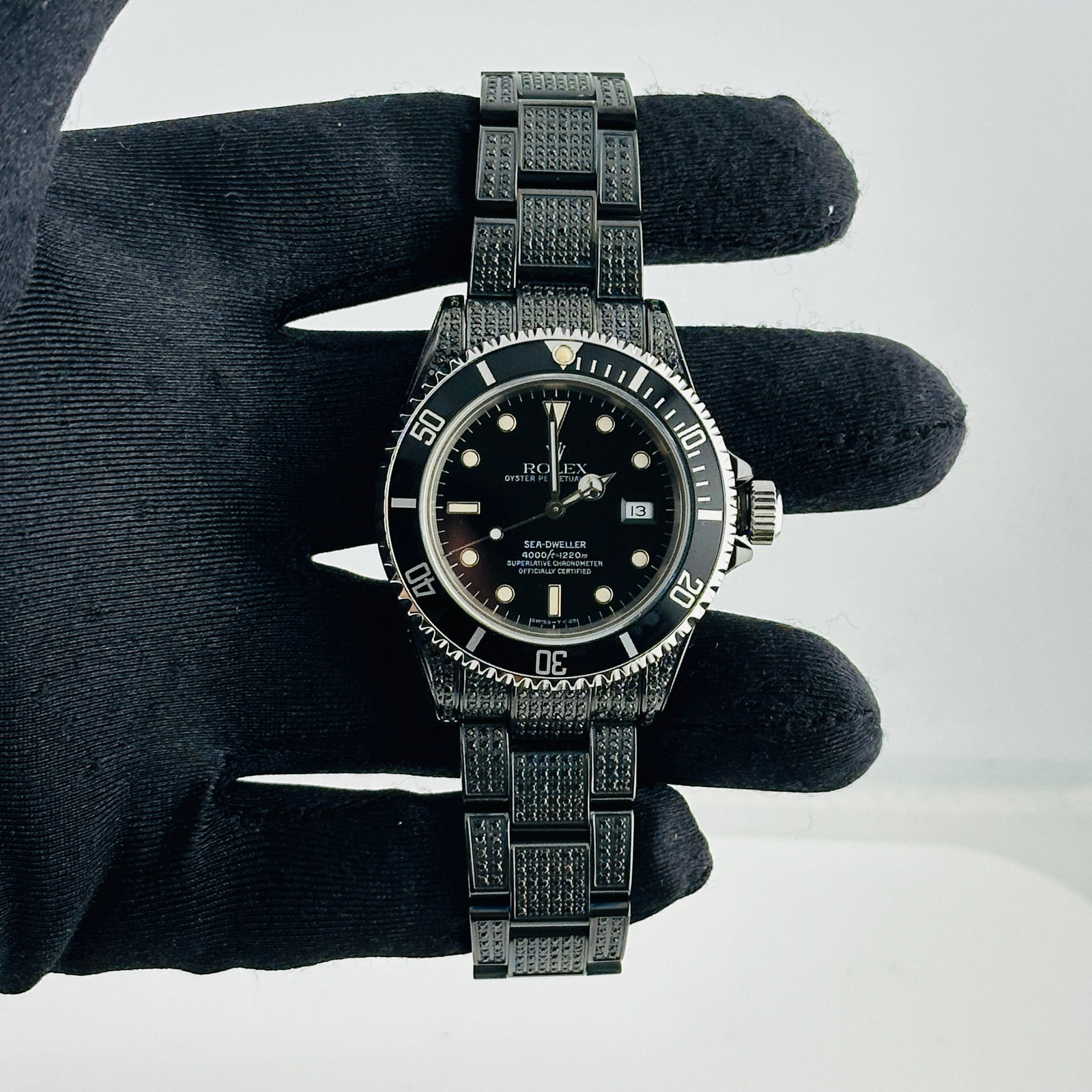 Rolex Sea-Dweller Ref 16600 Black Dial Watch With Diamond PVD Oyster Bracelet: Rolex Sea-Dweller Ref 16600 Black Dial Watch With Diamond PVD Oyster Bracelet This Rolex Sea-Dweller features a black dial and an Oyster bracelet adorned with diamonds and a PVD finish. The watch is e