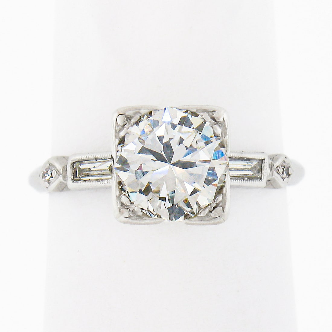 Vintage Platinum 1.50ct Old Transitional Cut Diamond Engagement Ring: Vintage Platinum 1.50ct Old Transitional Cut Diamond Engagement Ring This exquisite vintage engagement ring is crafted from solid platinum, showcasing a stunning 1.50 carat total weight of diamonds. T