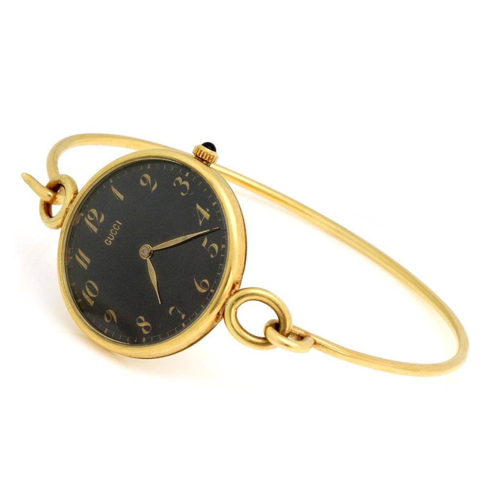 Gucci Vintage 18k Yellow Gold Hand Wound Ladies Watch with Wire Hook Band: Gucci Vintage 18k Yellow Gold Hand Wound Ladies Watch with Wire Hook Band Discover a stunning vintage ladies' wristwatch by Gucci, expertly crafted from 18k yellow gold. This chic timepiece features a