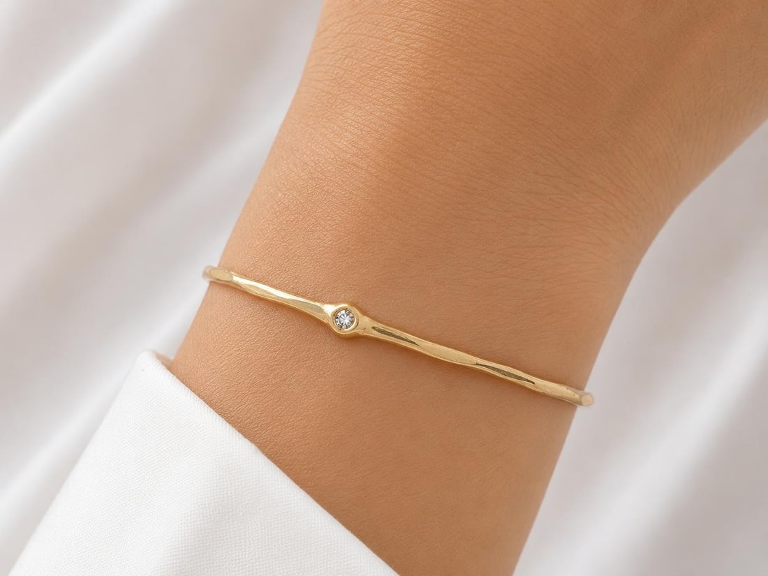 Unbranded 18K Yellow Gold Bangle Bracelet with 2 Round Diamonds 0.05ctw: Unbranded 18K Yellow Gold Bangle Bracelet with 2 Round Diamonds 0.05ctw Handmade slip-on bangle bracelet crafted in solid 18K yellow gold and set with two natural round brilliant cut diamonds totaling