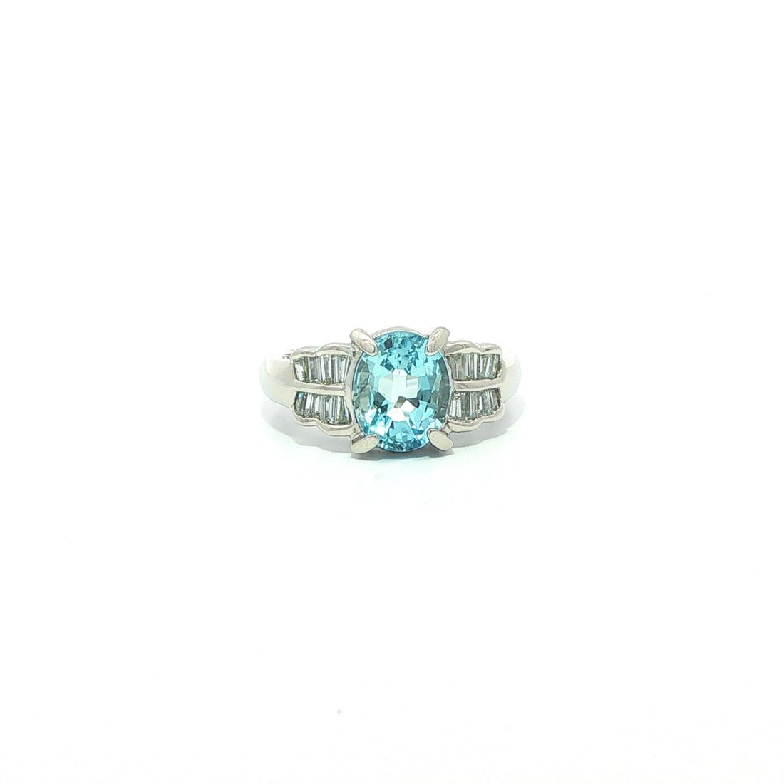 Platinum Aquamarine Ring with 16 Baguette Diamonds Size 5.5: Platinum Aquamarine Ring with 16 Baguette Diamonds Size 5.5 This elegant platinum cocktail ring features a 1.91 carat natural oval brilliant-cut aquamarine with a vibrant blue hue, prong set at the ce