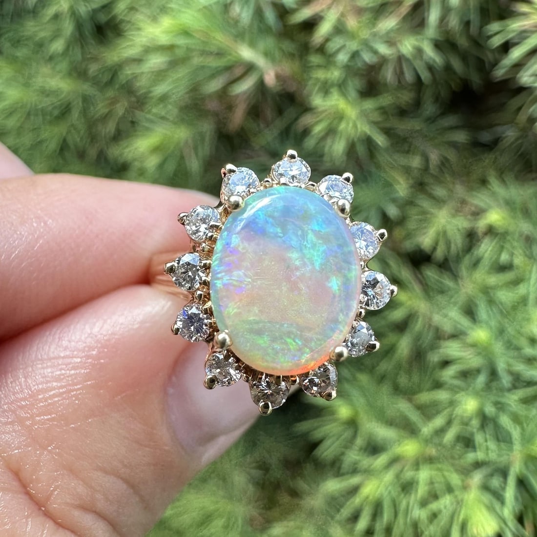 Unbranded 14k Yellow Gold Opal Diamond Halo Cocktail Ring Size 6: Unbranded 14k Yellow Gold Opal Diamond Halo Cocktail Ring Size 6 Vintage cocktail ring crafted in solid 14k yellow gold, featuring an oval natural opal at the center surrounded by a halo of 12 natural