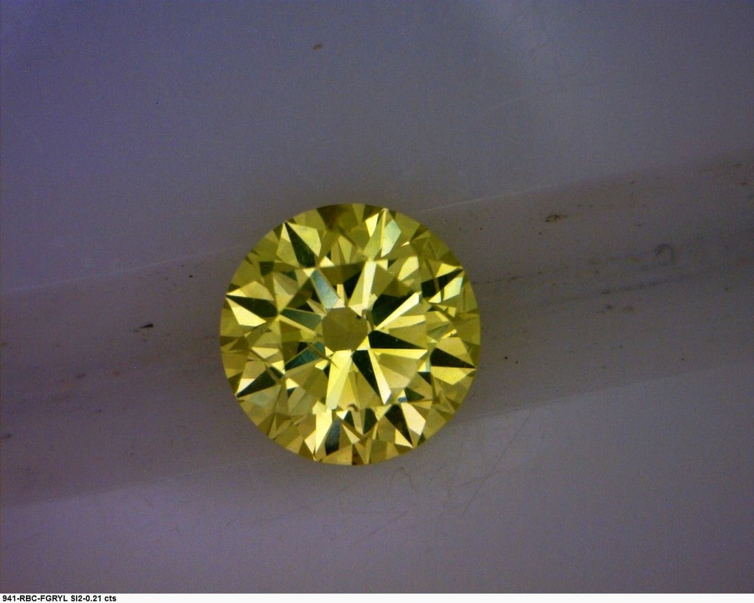 Loose Diamond - ROUND 0.21ct Fancy Greenish Yellow: Loose Diamond - ROUND 0.21ct Fancy Greenish Yellow Source: Natural Shape: ROUND Carats: 0.21 Color: Fancy Greenish Yellow Certification: GIA The Diamond Depot Guarantee: All items in this auction are 