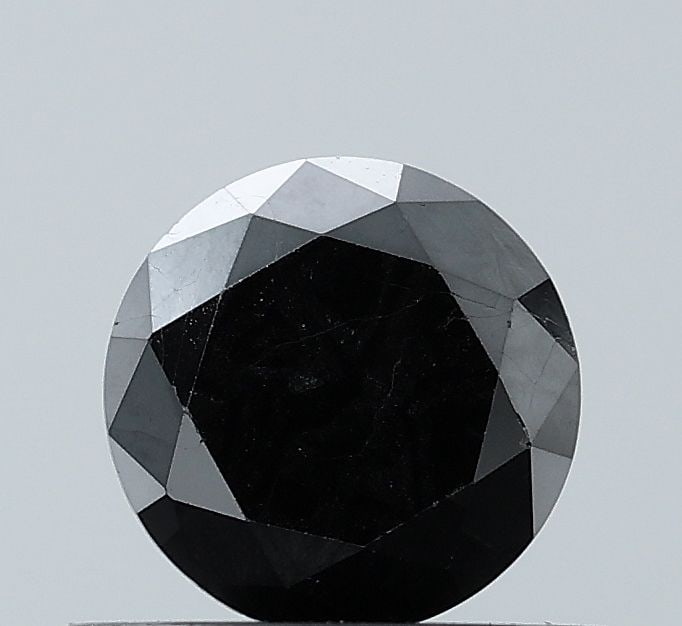 Loose Diamond - ROUND 0.71ct Fancy Black VVS2: Loose Diamond - ROUND 0.71ct Fancy Black VVS2 Source: Natural Shape: ROUND Carats: 0.71 Color: Fancy Black Certification: NONE Video: