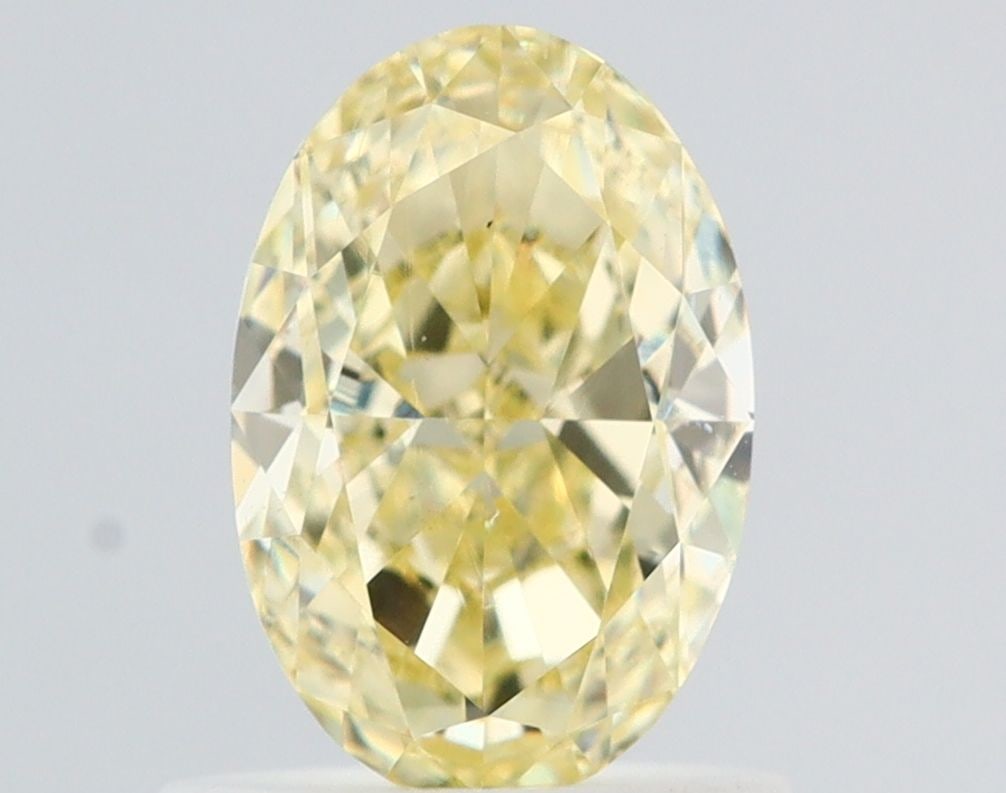 Loose Diamond - OVAL 0.99ct Fancy Light Yellow VS2: Loose Diamond - OVAL 0.99ct Fancy Light Yellow VS2 Source: Natural Shape: OVAL Carats: 0.99 Color: Fancy Light Yellow Certification: GIA Video:
