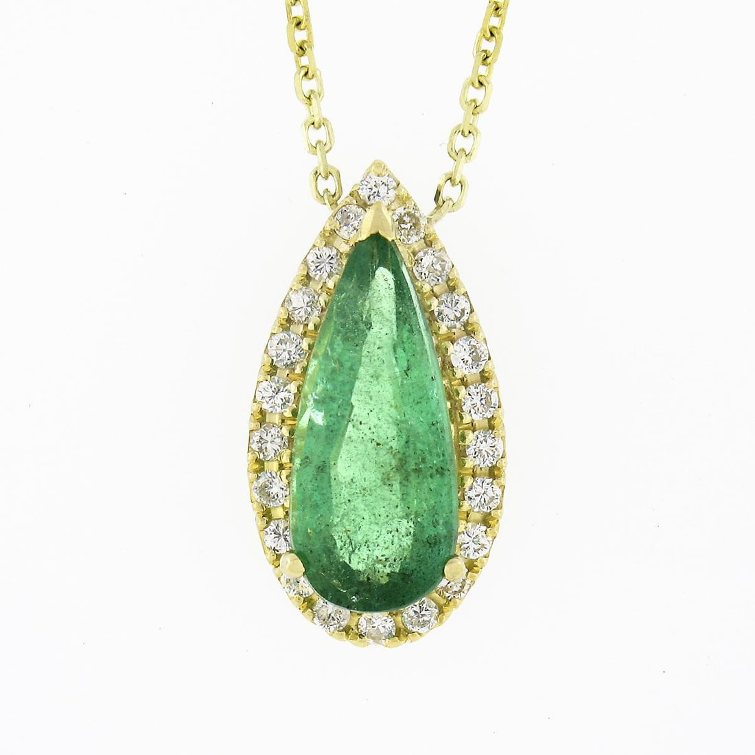 Unbranded 18K Yellow Gold Emerald Diamond Halo Y Drop Necklace: Unbranded 18K Yellow Gold Emerald Diamond Halo Y Drop Necklace Elegant Y-drop necklace featuring a natural elongated pear-cut emerald accented by a halo of natural diamonds in 18K solid yellow gold. T