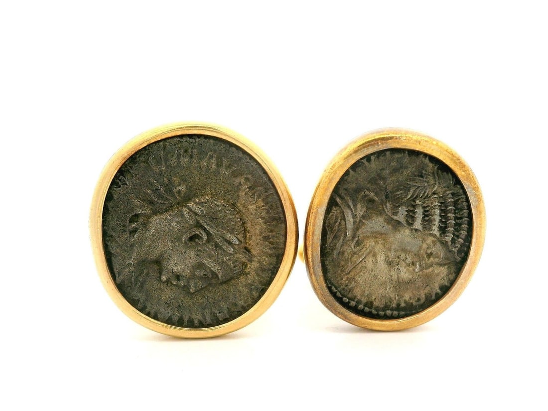 Bvlgari 18k Yellow Gold Roman Empire Coin Cufflinks: Bvlgari 18k Yellow Gold Roman Empire Coin Cufflinks These vintage cufflinks by Bvlgari feature a unique design incorporating ancient Roman Empire coins, set in solid 18k yellow gold. Weighing 23.6 gra
