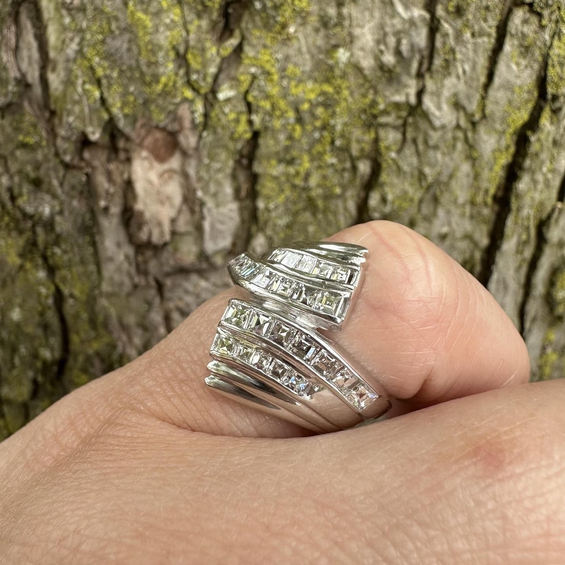 Platinum Wide Bypass Diamond Band Ring 1.04ctw Size 4: Platinum Wide Bypass Diamond Band Ring 1.04ctw Size 4 This vintage platinum bypass band ring features 24 natural carre square step cut diamonds, channel set for a striking and elegant look. The diamon