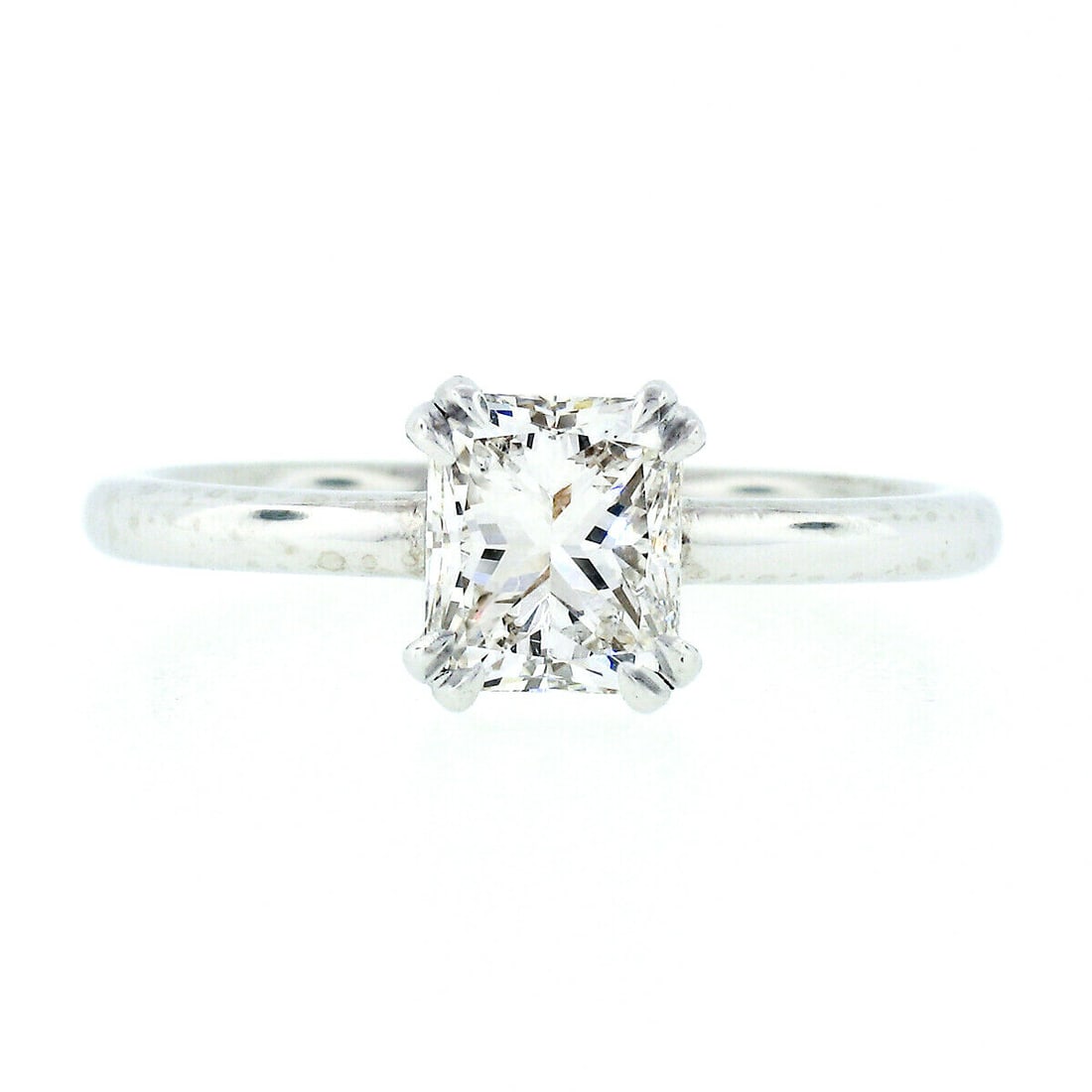 Platinum GIA Certified 1.11ct VS2 Radiant Cut Diamond Engagement Ring: Platinum GIA Certified 1.11ct VS2 Radiant Cut Diamond Engagement Ring This exquisite engagement ring features a stunning 1.11ct radiant cut diamond, certified by GIA for its outstanding quality. Set i