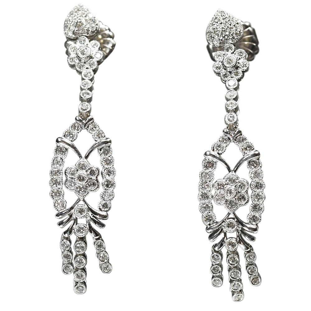 Round Brilliant Diamond Drop Earrings 14K White Gold 2.00 CTW G SI1: Round Brilliant Diamond Drop Earrings 14K White Gold 2.00 CTW G SI1 A pair of pre-owned diamond dangle earrings crafted in 14k white gold. These earrings feature natural round brilliant cut diamonds w