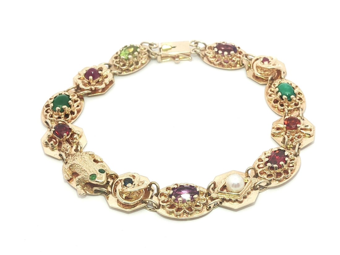 14k Yellow Gold Victorian Revival Bracelet with Multi Gemstones and Pearl Charms: 14k Yellow Gold Victorian Revival Bracelet with Multi Gemstones and Pearl Charms This vintage Victorian Revival charm slide bracelet is crafted from solid 14k yellow gold and features a collection of 