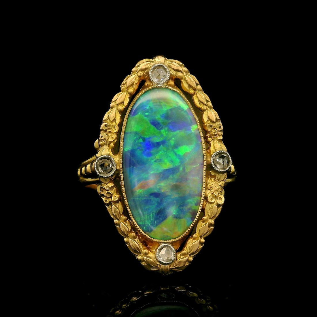 French Antique Art Nouveau GIA Certified Gold Opal Diamond Navette Ring: French Antique Art Nouveau GIA Certified Gold Opal Diamond Navette Ring This exquisite French Antique Art Nouveau ring showcases a stunning natural black opal complemented by sparkling diamonds. The r