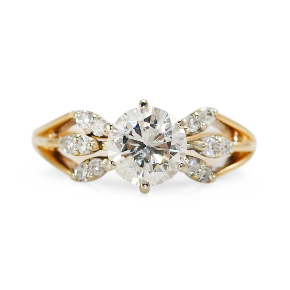 14k Yellow Gold Solitaire Ring with Round Brilliant Diamond: 14k Yellow Gold Solitaire Ring with Round Brilliant Diamond This 14k yellow gold ring features a 1.25-carat round brilliant natural diamond as the center stone, complemented by smaller single-cut diam
