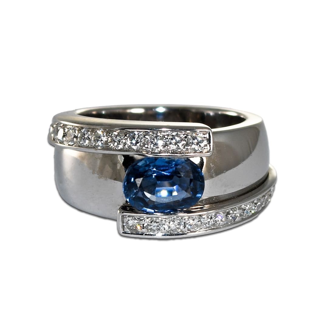 Unbranded 18K White Gold Cocktail Ring with Sapphire and Diamonds: Unbranded 18K White Gold Cocktail Ring with Sapphire and Diamonds Pre-owned unbranded cocktail ring crafted in 18k white gold, featuring a natural dark blue oval sapphire accented by round brilliant c