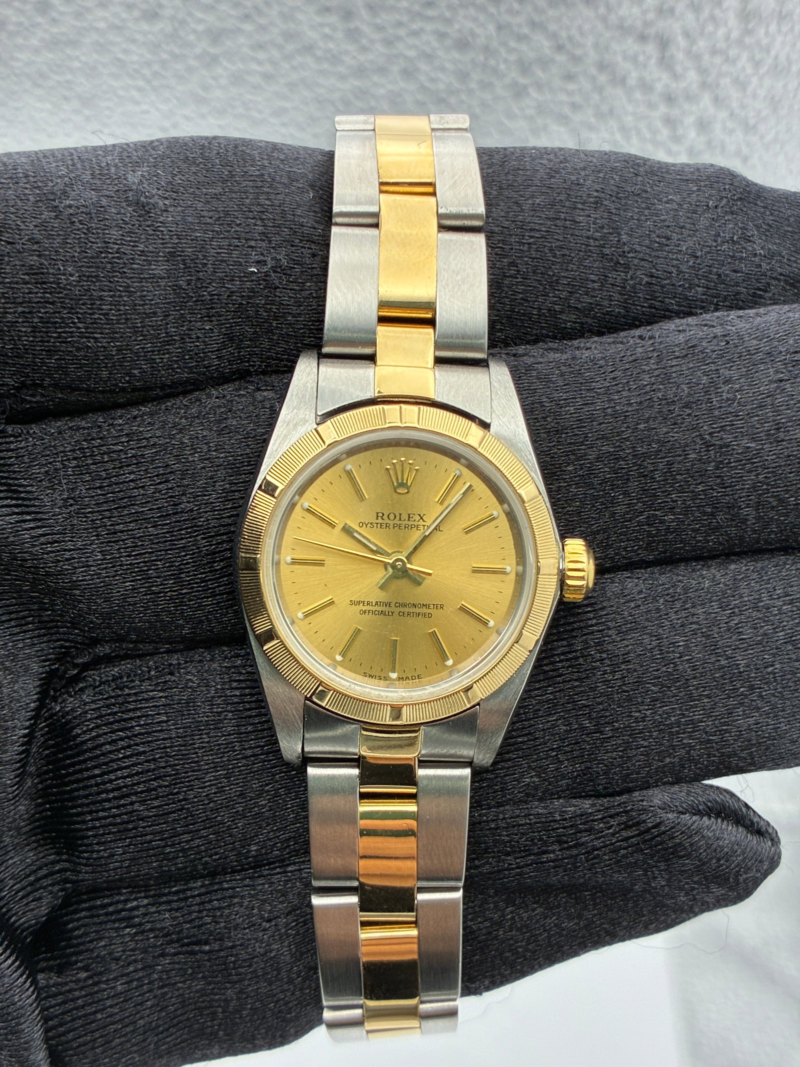 Rolex Oyster Perpetual Ladies Champagne Dial Oyster Bracelet Ref 76233: Rolex Oyster Perpetual Ladies Champagne Dial Oyster Bracelet Ref 76233 This Rolex Oyster Perpetual watch features a champagne stick dial and is fitted with an Oyster bracelet. Identified by reference 