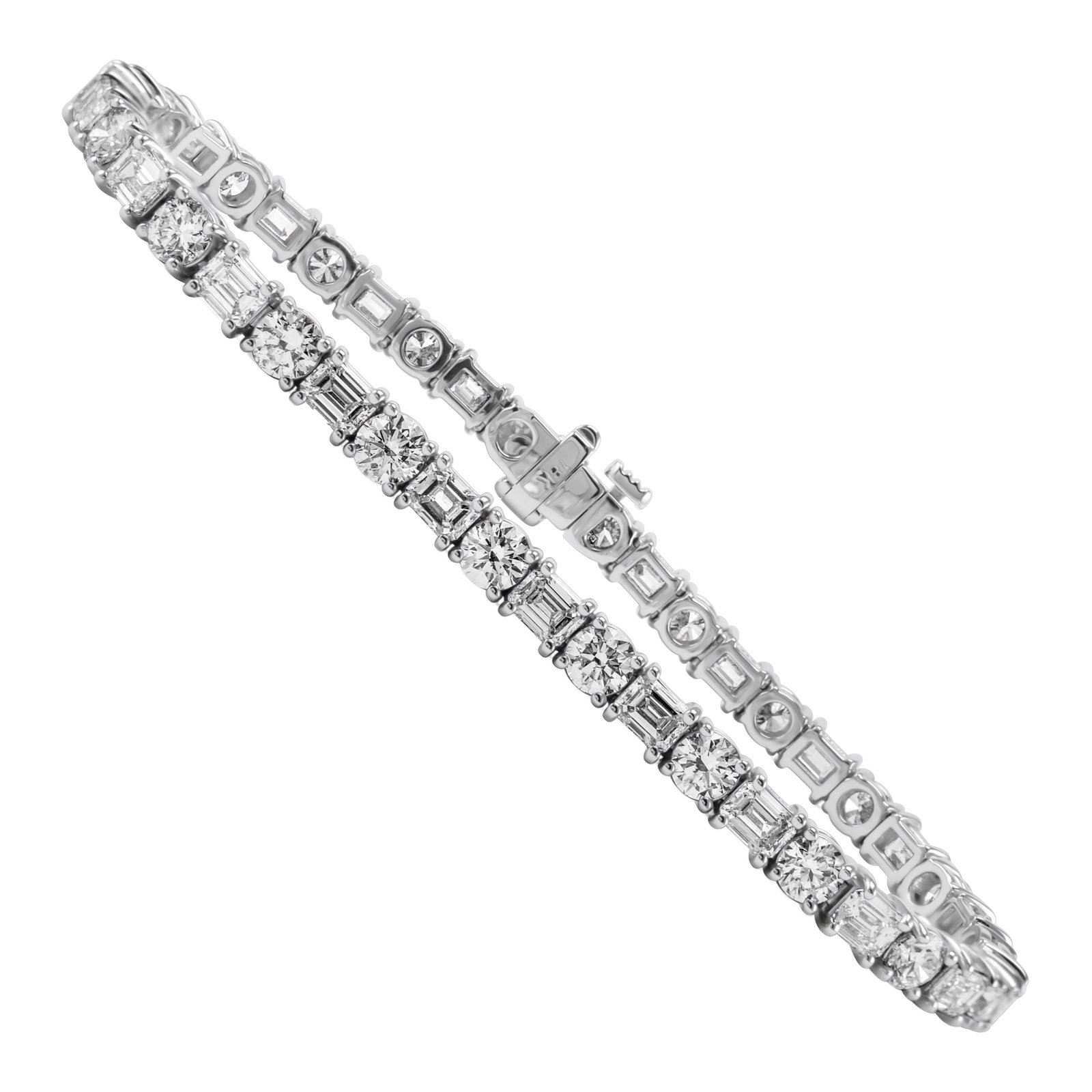 18k White Gold Diamond Tennis Bracelet 8.41ct: 18k White Gold Diamond Tennis Bracelet 8.41ct Contemporary tennis bracelet set with natural emerald cut and round diamonds in an east-west design. Crafted in 18k white gold, it features a total diamon