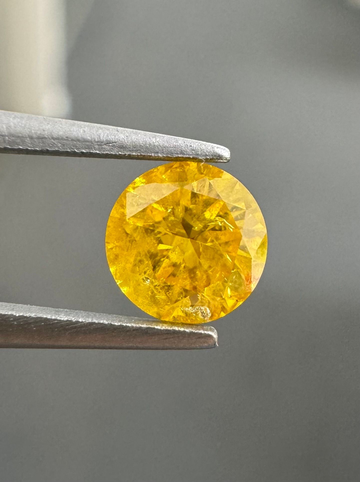 Loose Diamond - ROUND 0.53ct Fancy Vivid Orange Yellow I3: Loose Diamond - ROUND 0.53ct Fancy Vivid Orange Yellow I3 Source: Natural Shape: ROUND Carats: 0.53 Color: Fancy Vivid Orange Yellow Certification: GIA Video: