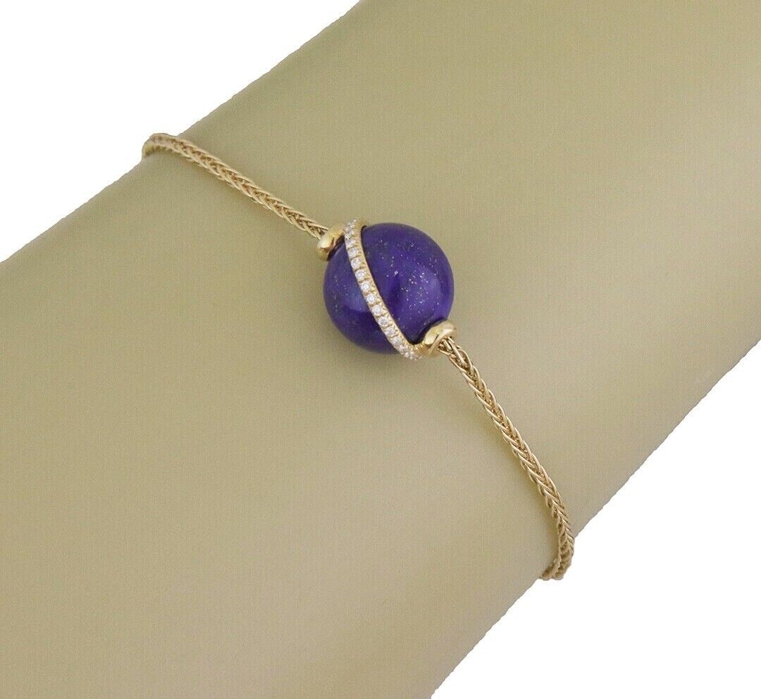 Fred of Paris Baie Des Anges 18k Yellow Gold Lapis Diamond Bracelet: Fred of Paris Baie Des Anges 18k Yellow Gold Lapis Diamond Bracelet Pre-owned Fred of Paris Baie De Anges bracelet crafted in 18k yellow gold with a natural lapis lazuli charm accented by natural diam