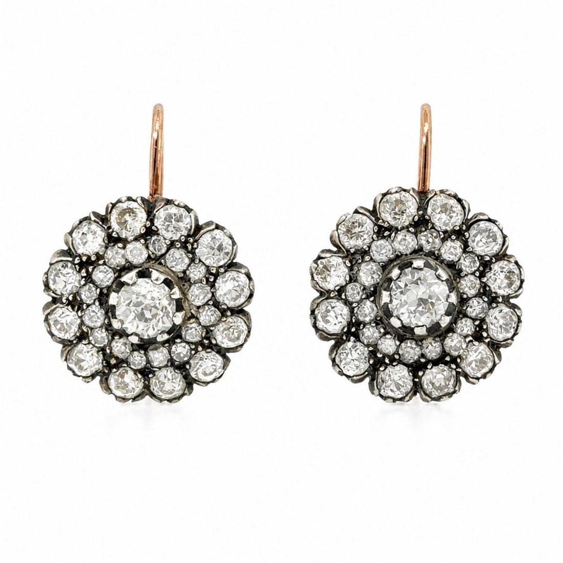 Diamond Cluster Earrings in 18K Rose Gold and Silver: Diamond Cluster Earrings in 18K Rose Gold and Silver Elegant cluster earrings crafted in 18K rose gold and silver, set with numerous old mine diamonds for a classic antique-inspired look. These pre-ow