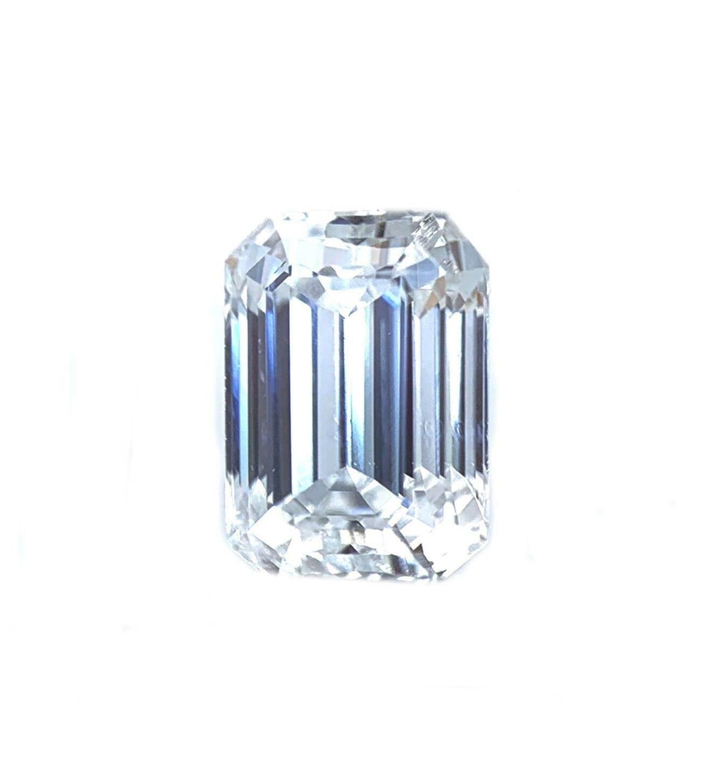 Natural Emerald Cut Diamond 0.74 Carat E-F Loose Solitaire: Natural Emerald Cut Diamond 0.74 Carat E-F Loose Solitaire Genuine untreated natural solitaire diamond in an emerald cut. This pre-owned loose stone is presented in a black presentation box and is sui