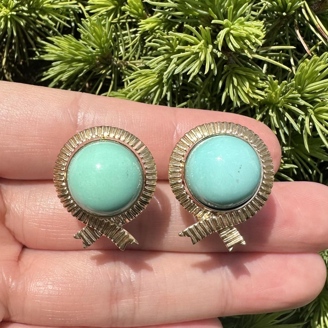 Turquoise Cabochon 14k Yellow Gold Button Earrings with Omega Back: Turquoise Cabochon 14k Yellow Gold Button Earrings with Omega Back These elegant earrings are crafted from solid 14k yellow gold and feature round cabochon-cut natural turquoise stones. Each earring s