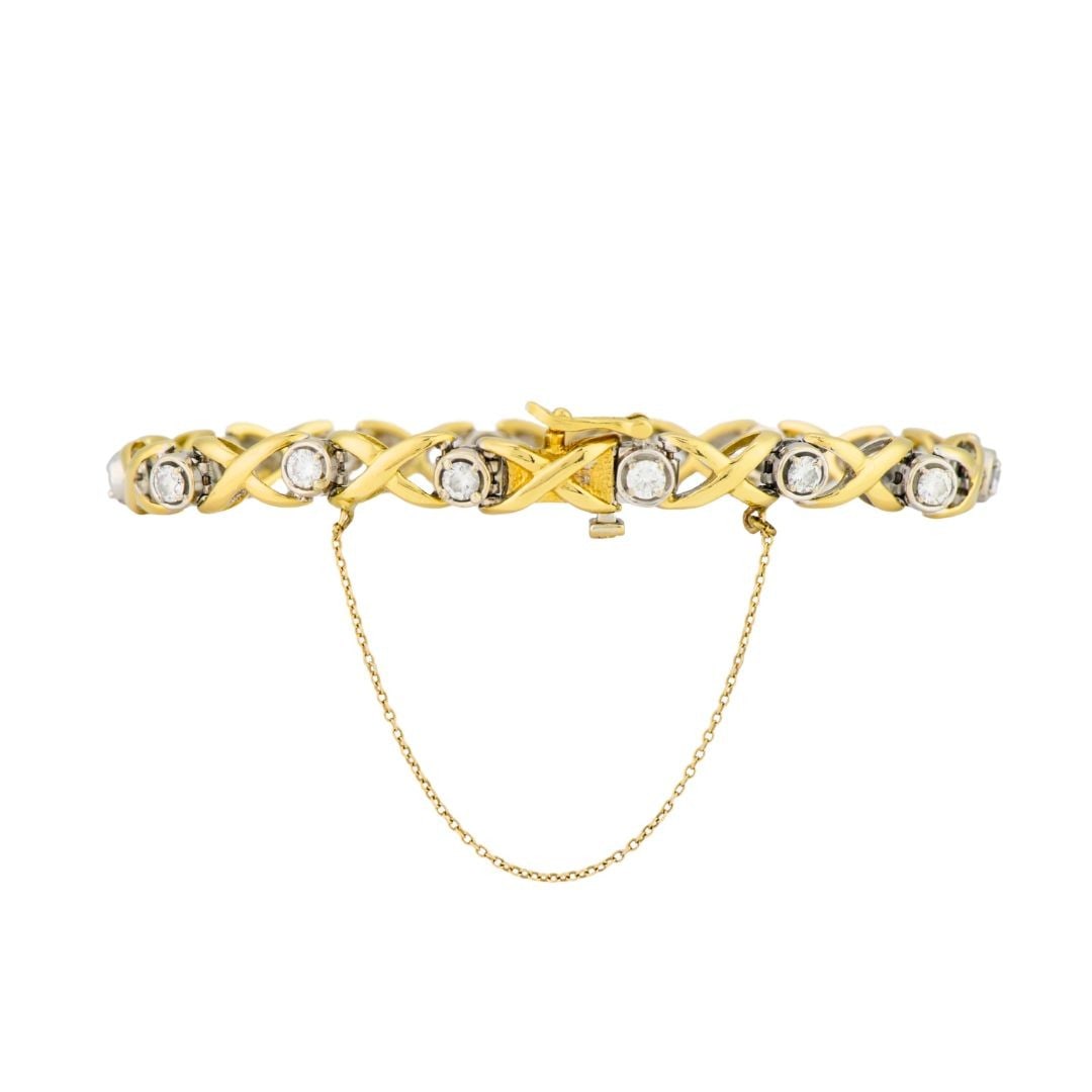 Natural Diamond 18K Yellow Gold Bracelet 7 Inch: Natural Diamond 18K Yellow Gold Bracelet 7 Inch Well-crafted pre-owned 18K yellow gold diamond bracelet set with 14 round brilliant cut natural diamonds. The diamonds total 1.75 carats and are graded 