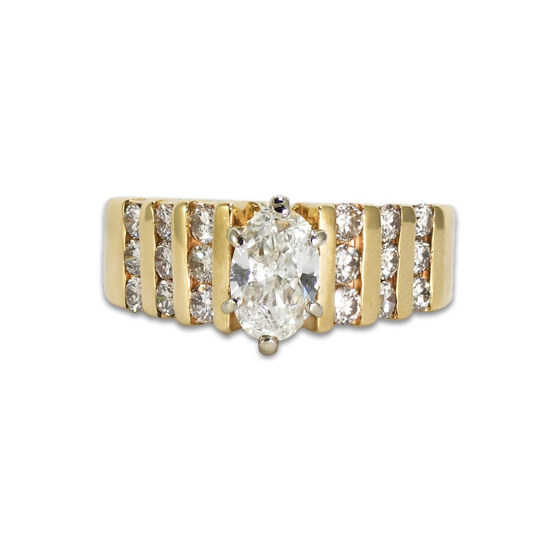 Oval Diamond 14K Yellow Gold Engagement Ring Size 6.25: Oval Diamond 14K Yellow Gold Engagement Ring Size 6.25 This elegant engagement ring features a 0.90 carat oval-shaped natural diamond set in a 14k yellow gold setting. The center diamond displays H-I 