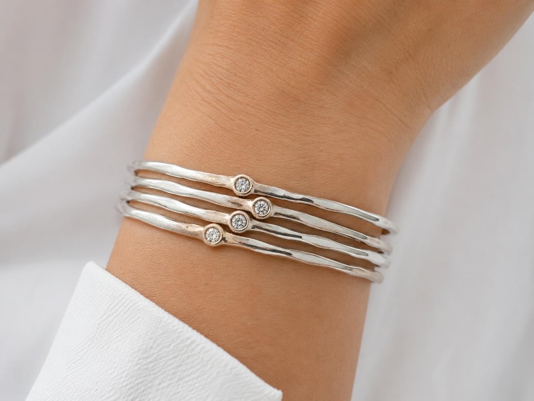 Set of 4 Handmade 18K White Gold Freeform Diamond Slip On Bangles: Set of 4 Handmade 18K White Gold Freeform Diamond Slip On Bangles Handmade set of 4 stackable slip-on bangle bracelets crafted in solid 18K white gold and accented with natural round brilliant cut dia
