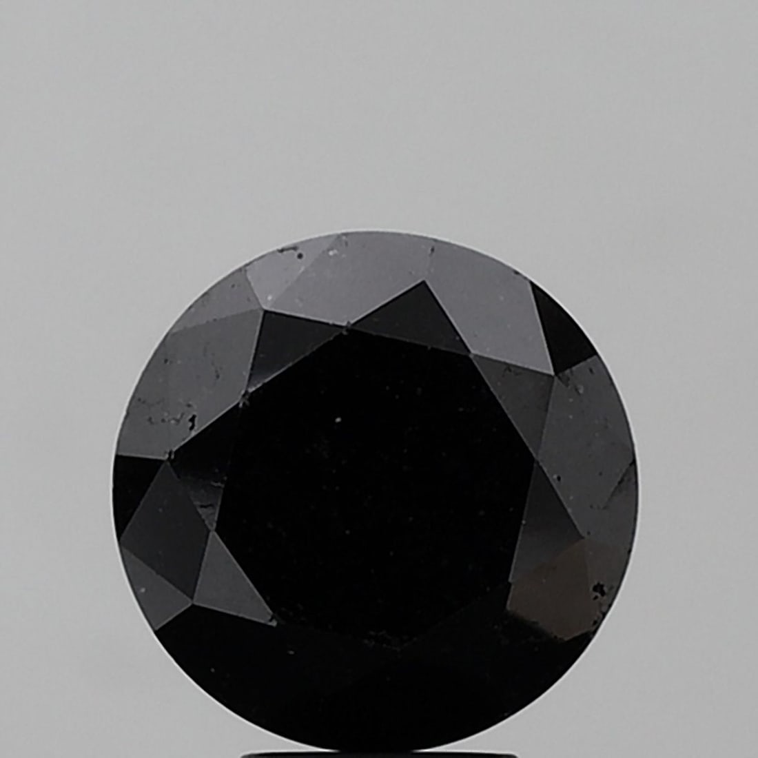 Loose Diamond - ROUND 5.71ct Black I1: Loose Diamond - ROUND 5.71ct Black I1 Source: Natural Shape: ROUND Carats: 5.71 Color: Black Certification: NONE Video: