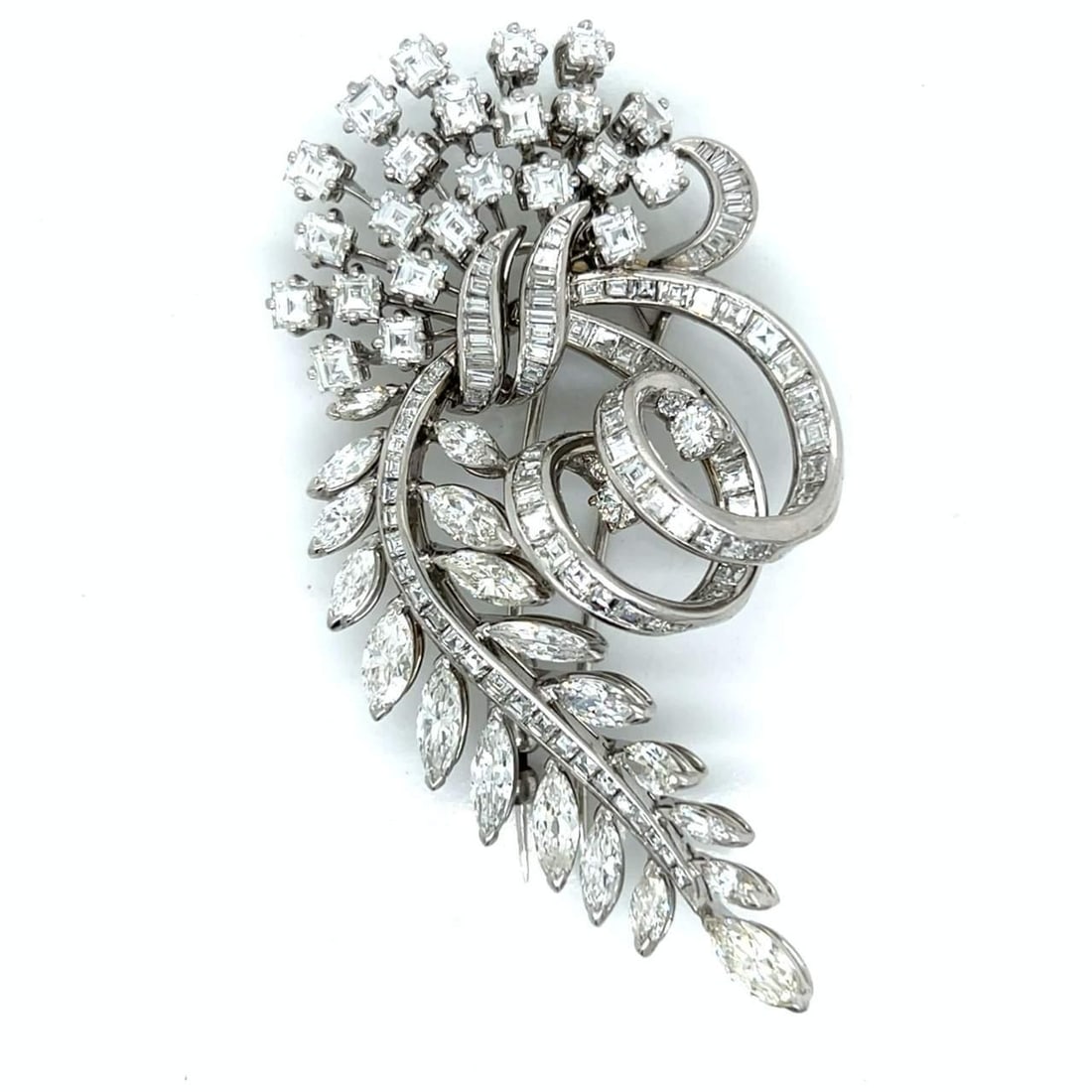 Art Deco Platinum 19.10 Ct Diamond Brooch with Emerald Baguette Marquise Diamonds: Art Deco Platinum 19.10 Ct Diamond Brooch with Emerald Baguette Marquise Diamonds This exquisite Art Deco brooch is crafted in platinum and features a stunning total diamond weight of 19.10 Ct. It is 