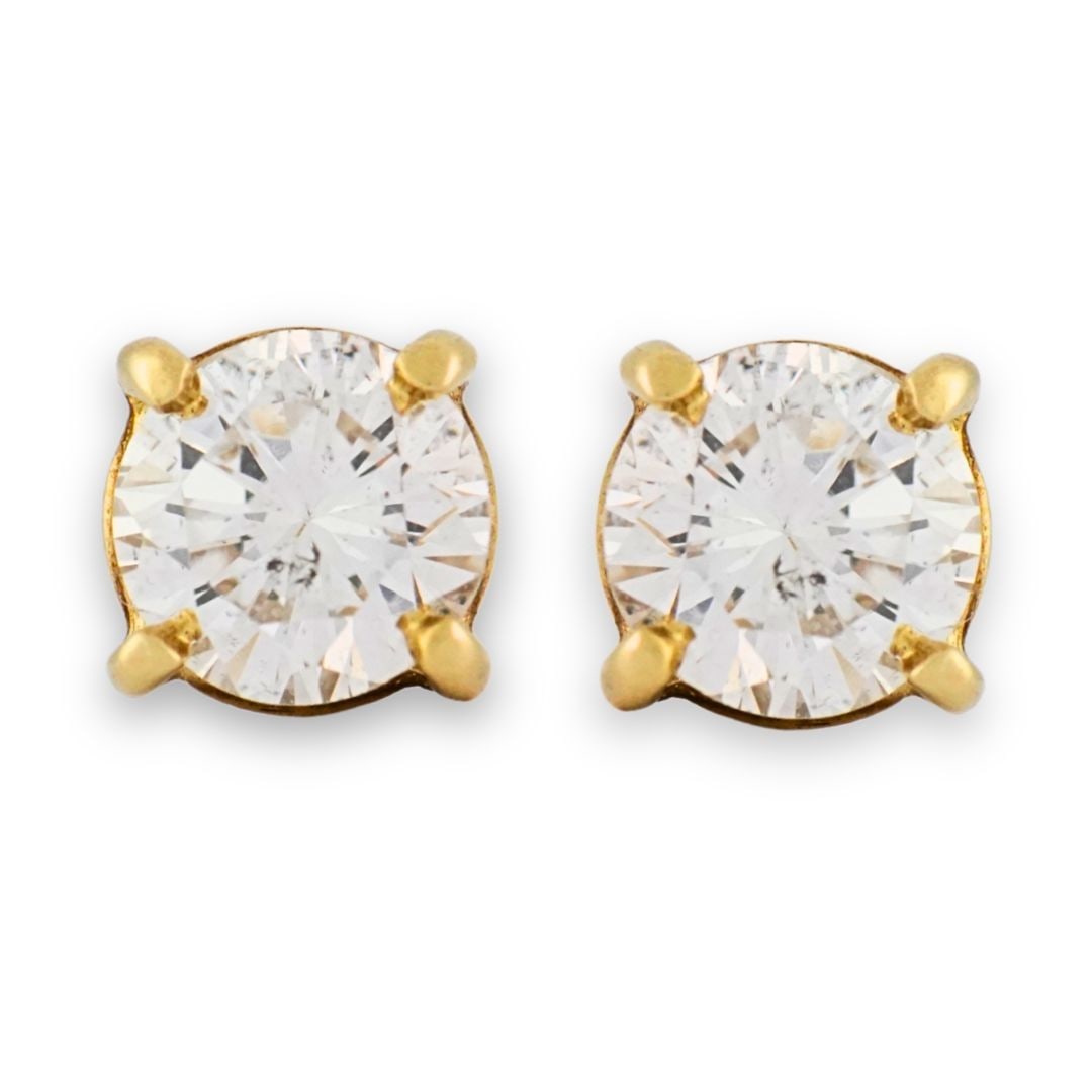 Round Brilliant Diamond Stud Earrings 14k Yellow Gold Screw Back Pair: Round Brilliant Diamond Stud Earrings 14k Yellow Gold Screw Back Pair These stud earrings feature round brilliant cut natural diamonds set in 14K yellow gold. The diamonds have a total weight of 0.80 