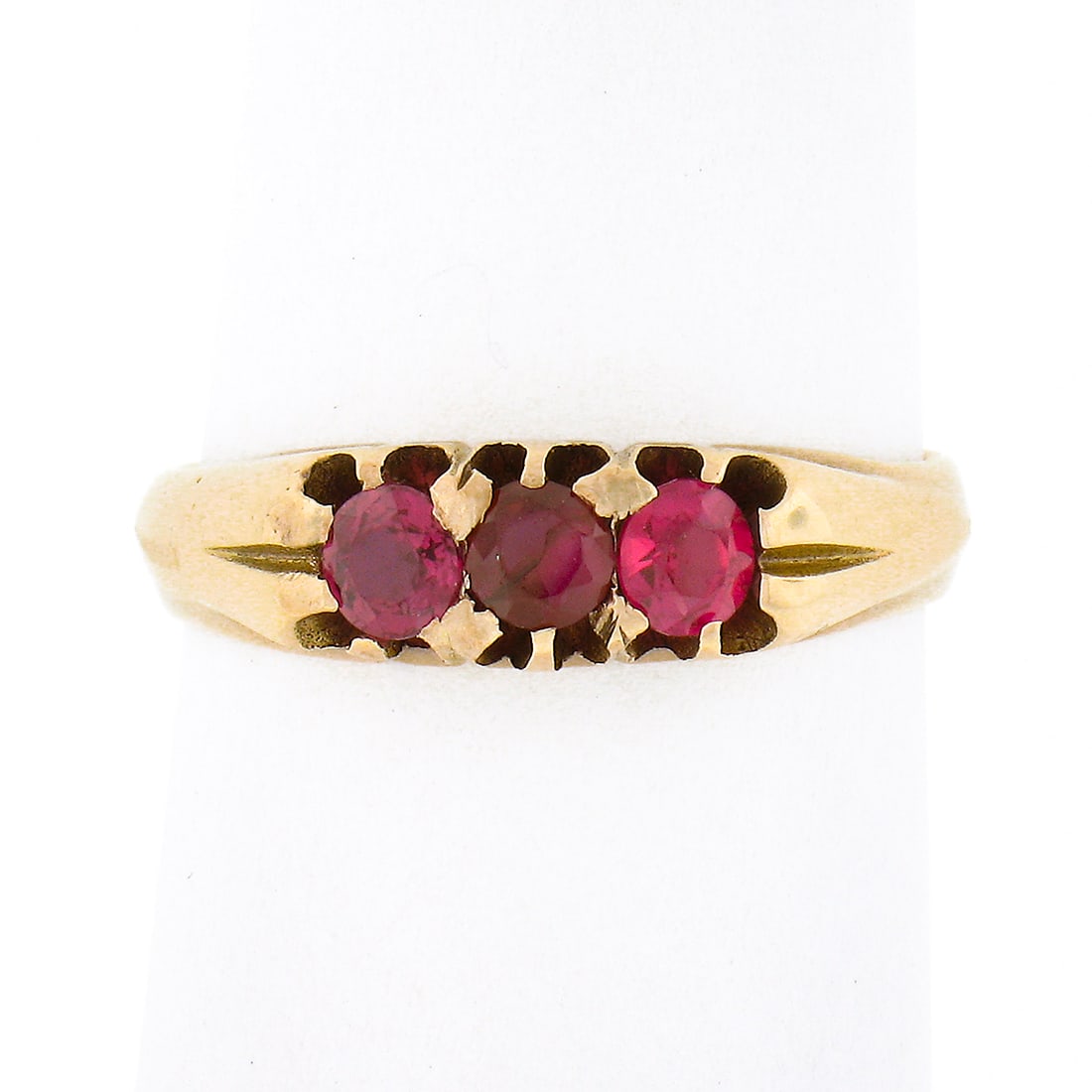 Victorian 14K Yellow Gold 0.45ct Red Spinel 3 Stone Band Ring: Victorian 14K Yellow Gold 0.45ct Red Spinel 3 Stone Band Ring This exquisite Antique Victorian ring is crafted from solid 14K yellow gold and features a stunning trio of round cut red spinel stones, t