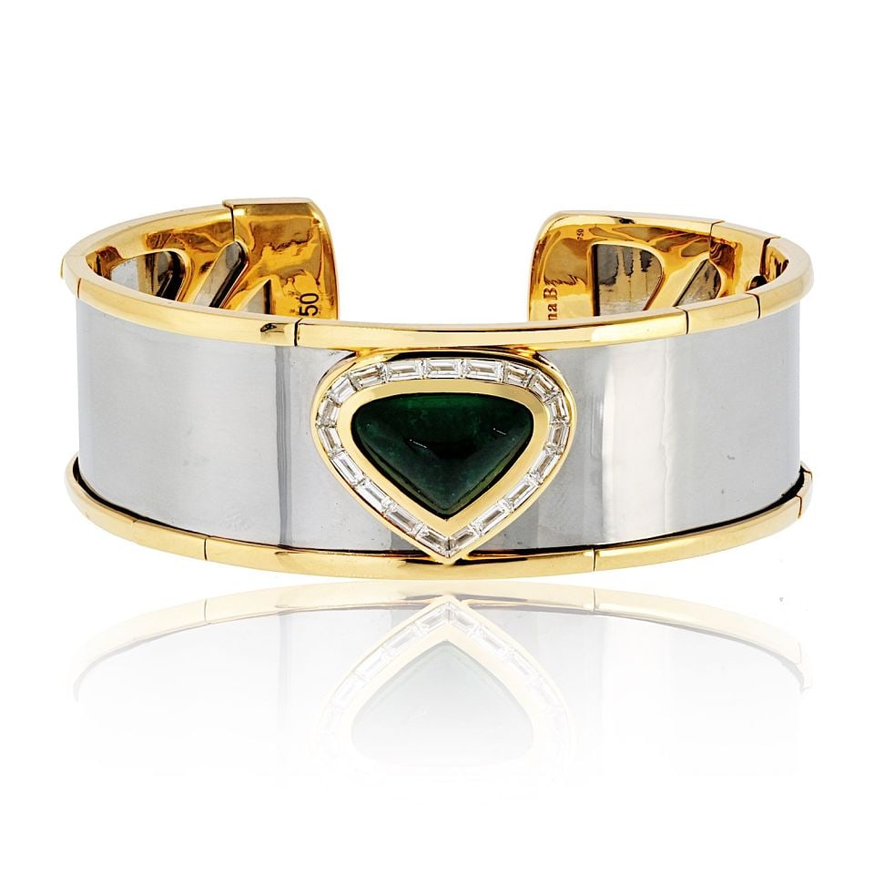 Marina B Emerald Diamond 18K Gold and Steel Statement Cuff Bracelet: Marina B Emerald Diamond 18K Gold and Steel Statement Cuff Bracelet This Marina B. cuff bracelet is crafted from 18K yellow gold and stainless steel, featuring a cabochon-cut green emerald at its cent