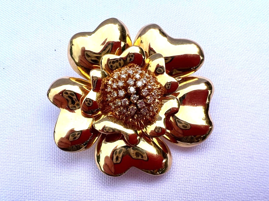 French 18K Yellow Gold Floral Diamond Necklace Brooch: French 18K Yellow Gold Floral Diamond Necklace Brooch This exquisite French brooch doubles as a necklace and is crafted from 18K yellow gold, showcasing a stunning floral design. Weighing 45.60 grams,