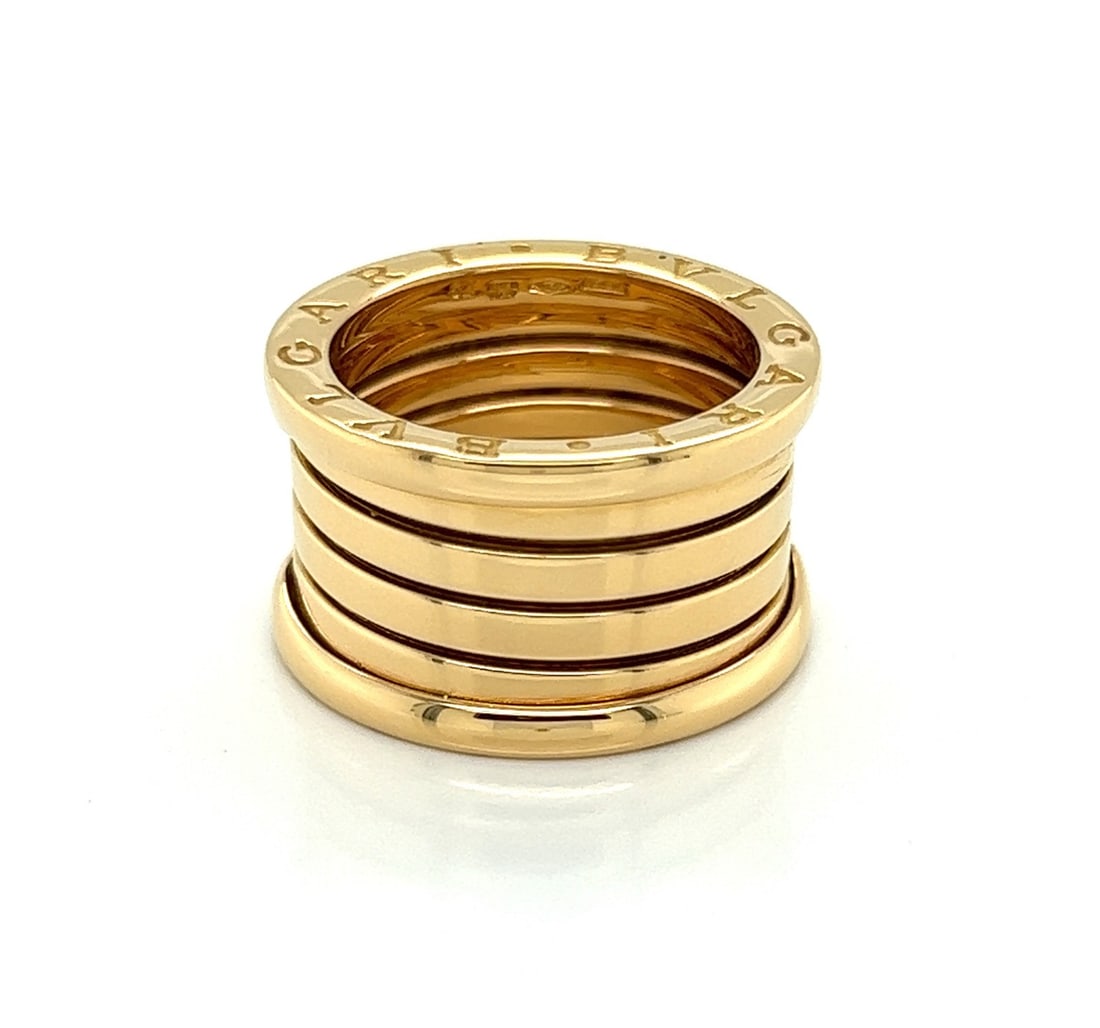 Bvlgari B.zero1 18k Yellow Gold Five Band Anniversary Ring US 5.5 EU 52: Bvlgari B.zero1 18k Yellow Gold Five Band Anniversary Ring US 5.5 EU 52 Pre-owned Bvlgari B.zero1 Anniversary five-band ring crafted in 18k yellow gold. This signed design features movable central str