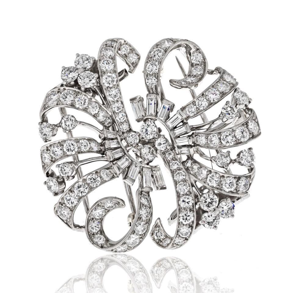 Platinum Diamond Double Clip Brooch with 7.2cttw by Tiffany & Co.: Platinum Diamond Double Clip Brooch with 7.2cttw by Tiffany & Co. This Tiffany & Co. brooch is crafted from platinum and features round and baguette diamonds with a total weight of 7.2 carats. The bro