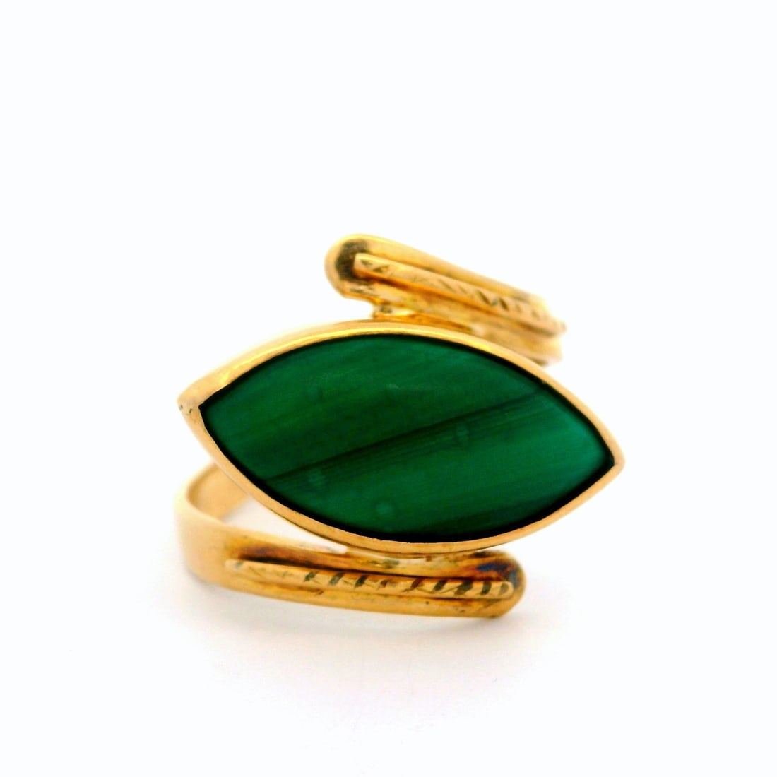 Vintage 9k Yellow Gold Malachite Cabochon Bypass Cocktail Ring: Vintage 9k Yellow Gold Malachite Cabochon Bypass Cocktail Ring This stunning vintage cocktail ring features a beautiful marquise cabochon of natural malachite, showcasing a vivid green color with stri