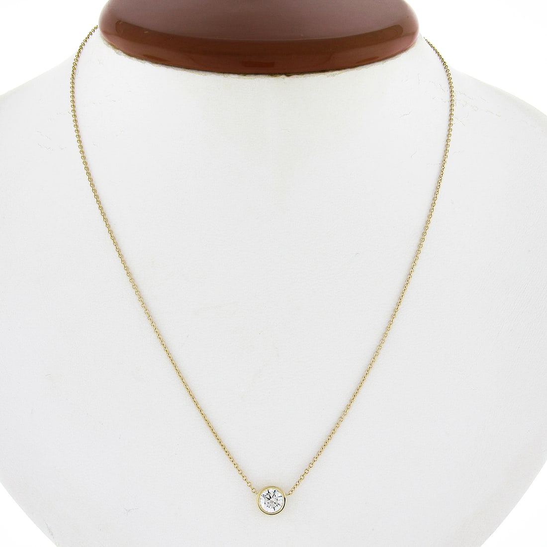 14K Yellow Gold 0.56ct Round Bezel Diamond Pendant with Adjustable Cable Chain: 14K Yellow Gold 0.56ct Round Bezel Diamond Pendant with Adjustable Cable Chain This exquisite 14K Yellow Gold pendant features a stunning 0.56 ct round bezel-set diamond, making it an ideal accessory 