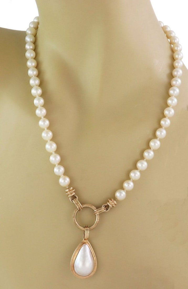 Vintage Multi Strand Pearl Lariat Necklace with 14k Gold Pear Pendant: Vintage Multi Strand Pearl Lariat Necklace with 14k Gold Pear Pendant Vintage multi-strand pearl necklace with a removable pear-shaped pendant centerpiece. Crafted in 14k yellow gold, this original es