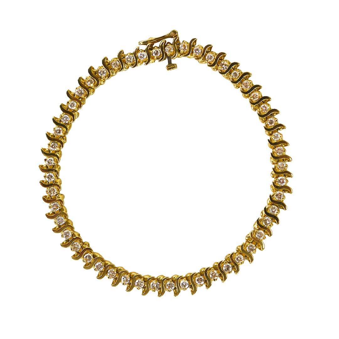 Unbranded 14K Gold Tennis Bracelet with 1.50ct Round Diamond Accents: Unbranded 14K Gold Tennis Bracelet with 1.50ct Round Diamond Accents Pre-owned 14k yellow gold tennis bracelet set with natural round brilliant diamonds. The bracelet features approximately 1.50 total