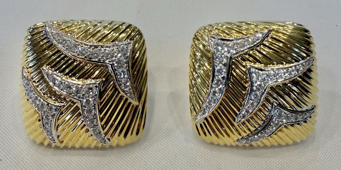 Pair of 18K Yellow and White Gold Diamond Cuff Earrings 29g: Pair of 18K Yellow and White Gold Diamond Cuff Earrings 29g This pair of cuff earrings is crafted from 18k yellow and white gold and features approximately 0.35ct of GSI diamonds. Each earring measure