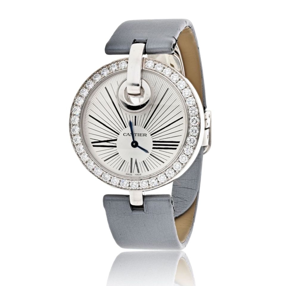 Captive de Cartier 35mm Diamond Bezel 18K White Gold Watch: Captive de Cartier 35mm Diamond Bezel 18K White Gold Watch This pre-owned Captive de Cartier watch features a 35mm round case crafted from 18K white gold, highlighted by a brilliant diamond bezel. The