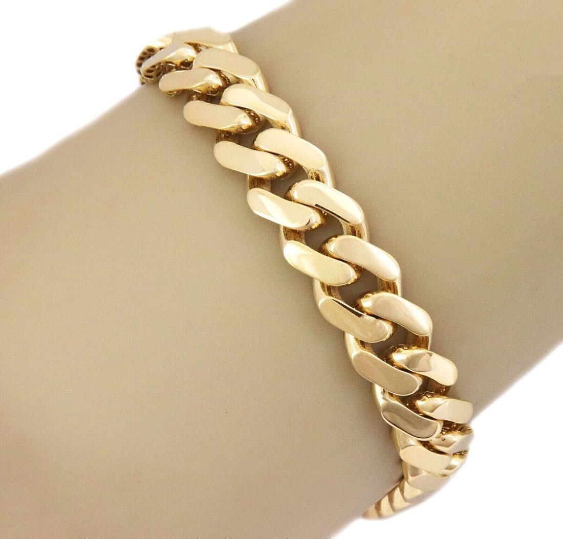 Monaco 14k Yellow Gold Flat Cuban Link Bracelet 8.25 in: Monaco 14k Yellow Gold Flat Cuban Link Bracelet 8.25 in Classic Monaco Chain bracelet crafted in 14k yellow gold with a flat Cuban link design and polished finish. The hollow link construction offers 