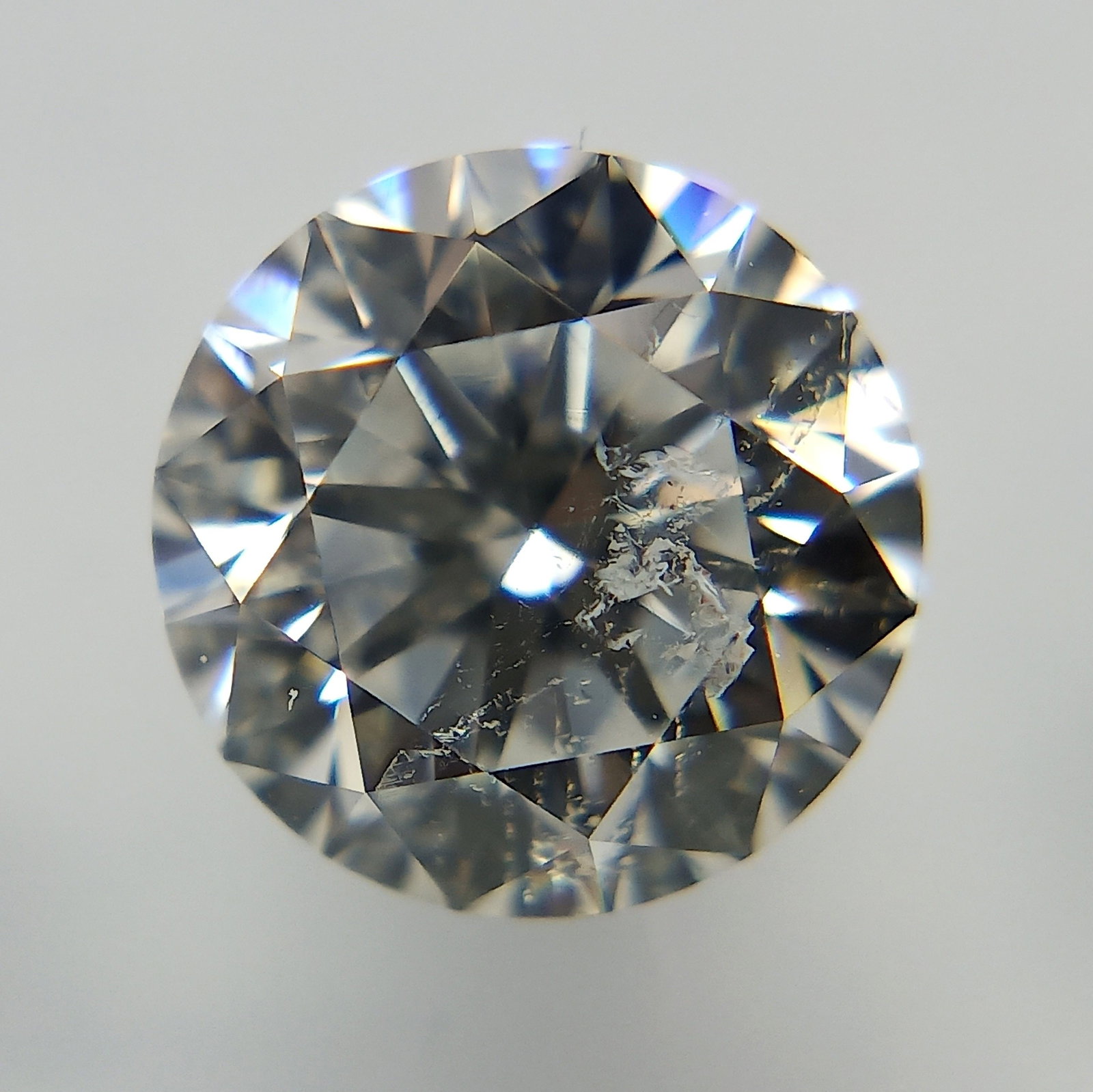 Loose Diamond - ROUND 1.09ct E I1: Loose Diamond - ROUND 1.09ct E I1 Source: Natural Shape: ROUND Carats: 1.09 Color: E Clarity: I1 Certification: IGI The Diamond Depot Guarantee: All items in this auction are guaranteed to be 100% aut