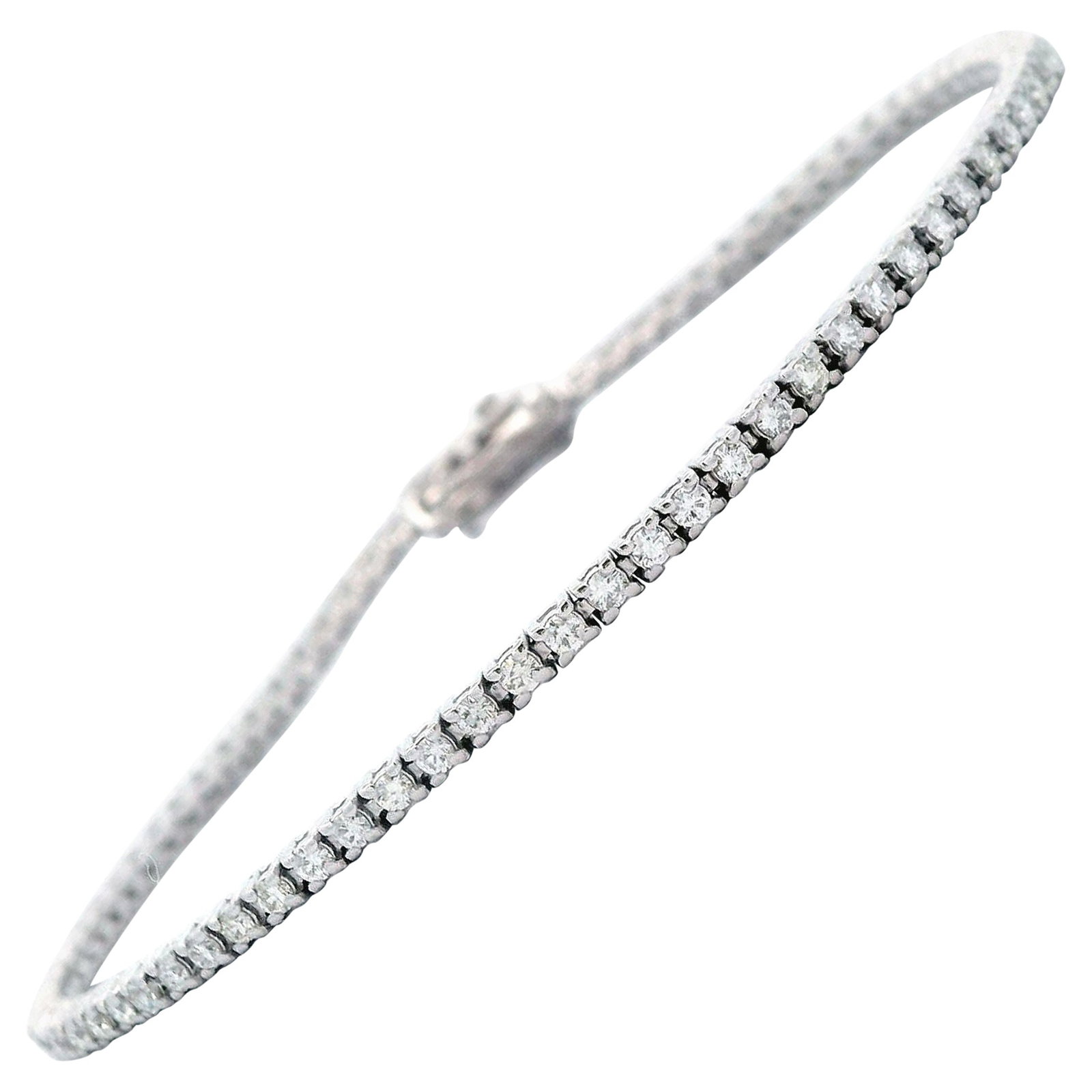 1.26ct F VS1 Diamond Tennis Bracelet 18k White Gold: 1.26ct F VS1 Diamond Tennis Bracelet 18k White Gold This exquisite tennis bracelet features 80 round brilliant diamonds with a total weight of 1.26 carats, showcasing F/G color and VS clarity. Set in 